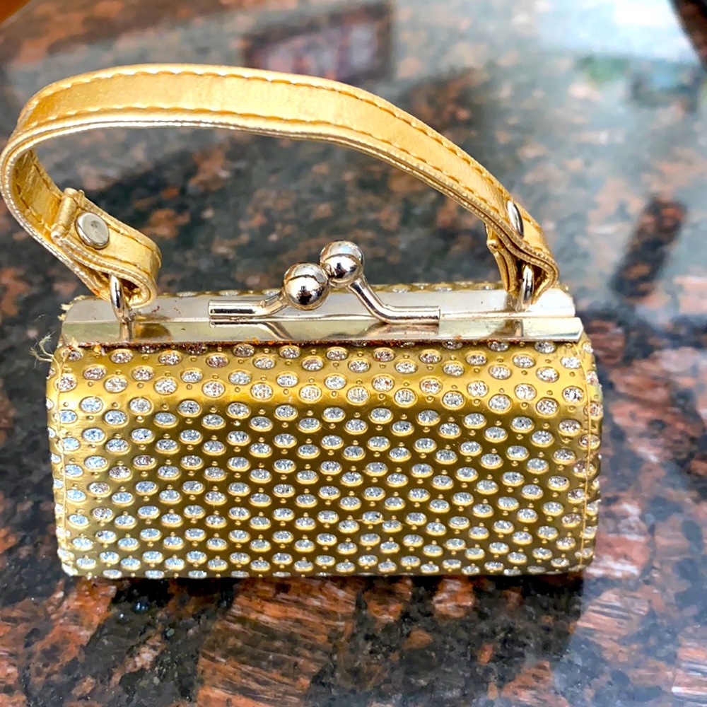 Gold sparkly lip case for lipstick etc